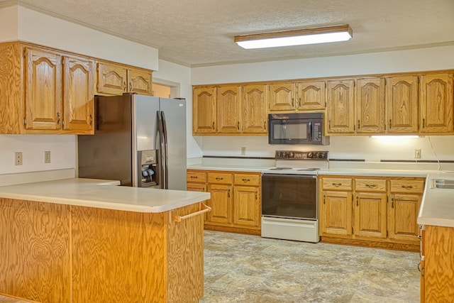 kitchen featuring electric stove, light countertops, black microwave, stainless steel fridge, and a peninsula