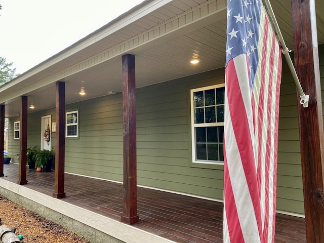 view of property exterior with covered porch