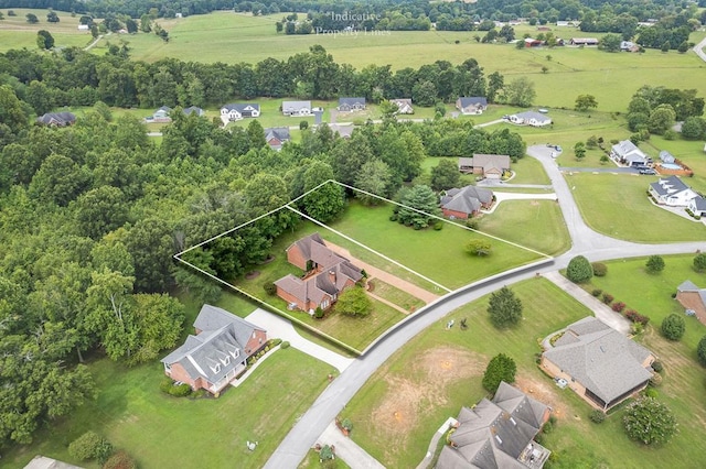 drone / aerial view featuring a residential view and a rural view