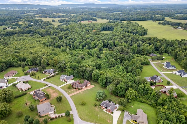 birds eye view of property with a residential view and a forest view