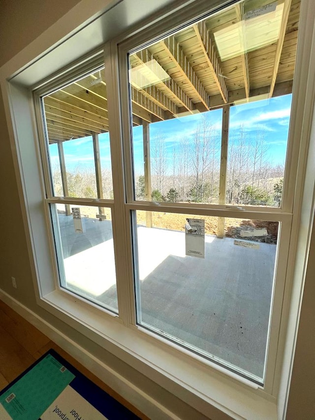 doorway featuring baseboards