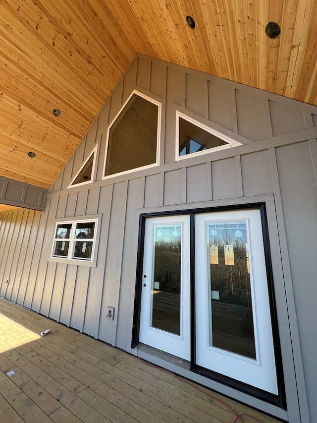 property entrance featuring board and batten siding