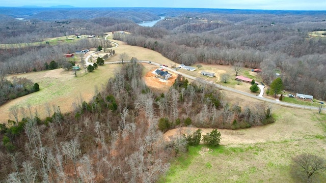 bird's eye view featuring a rural view and a forest view