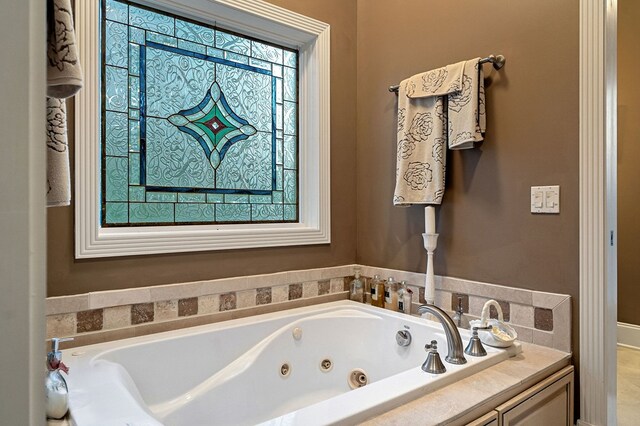 full bathroom featuring a jetted tub