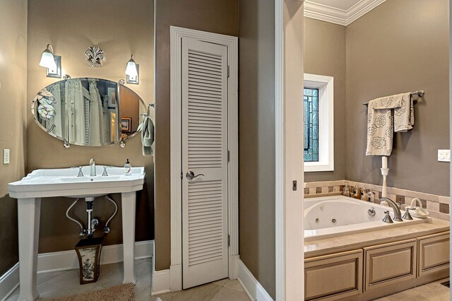 bathroom featuring a whirlpool tub, ornamental molding, a closet, and baseboards