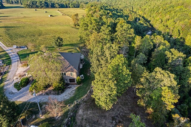 birds eye view of property with a rural view