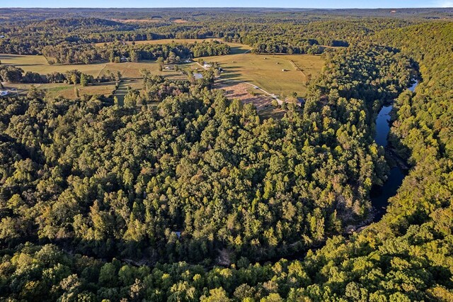 drone / aerial view featuring a forest view