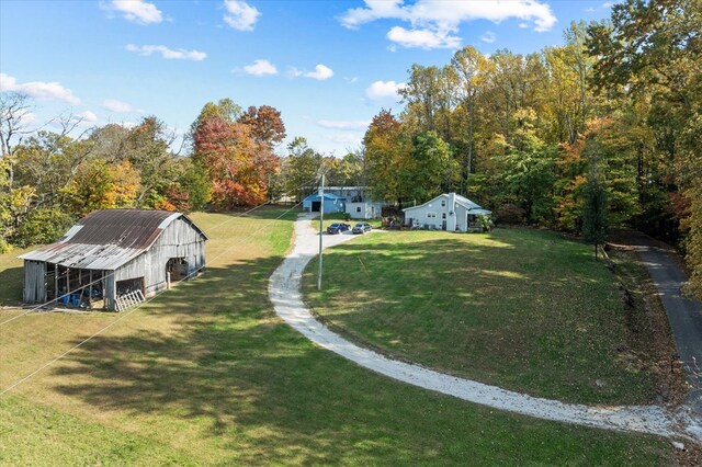 view of yard featuring an outbuilding and a barn