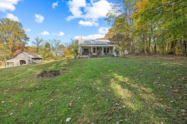 view of yard featuring covered porch