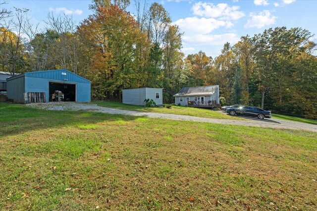 view of yard with an outbuilding and a detached garage