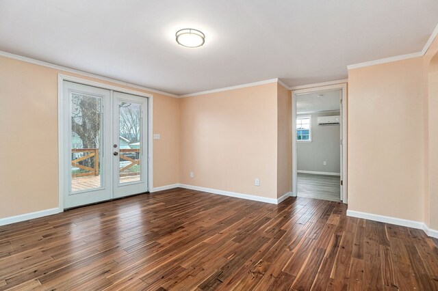 empty room featuring dark wood-style flooring, a wall unit AC, and baseboards