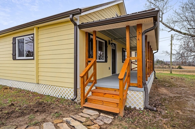 view of outdoor structure featuring covered porch