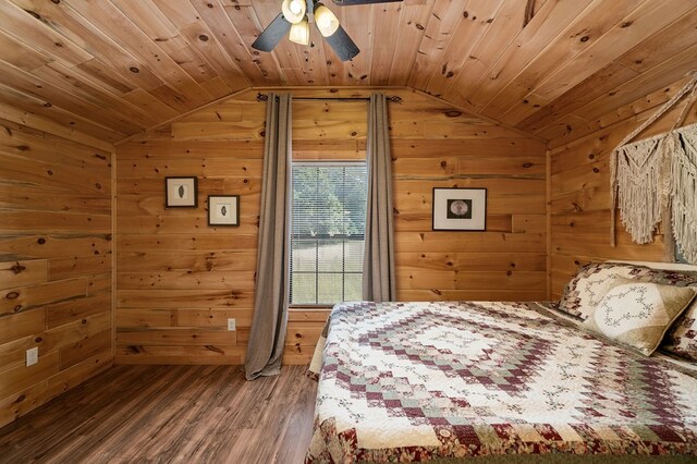 bedroom featuring wooden walls, wooden ceiling, lofted ceiling, and wood finished floors