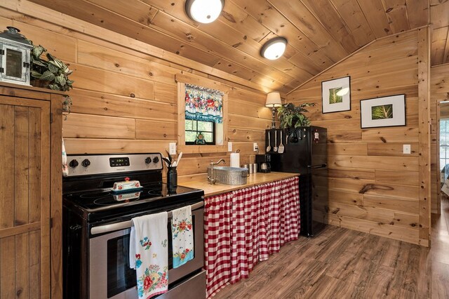 kitchen with stainless steel range with electric stovetop, wood finished floors, freestanding refrigerator, lofted ceiling, and wood ceiling