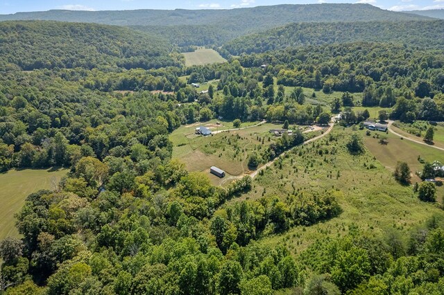 drone / aerial view featuring a view of trees