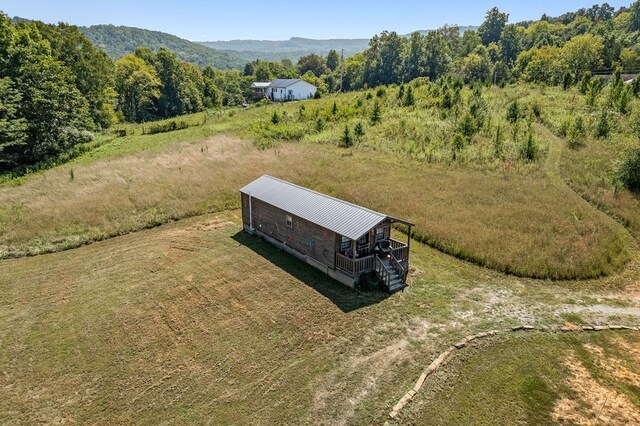 birds eye view of property with a mountain view