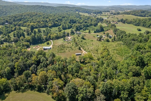 aerial view featuring a wooded view