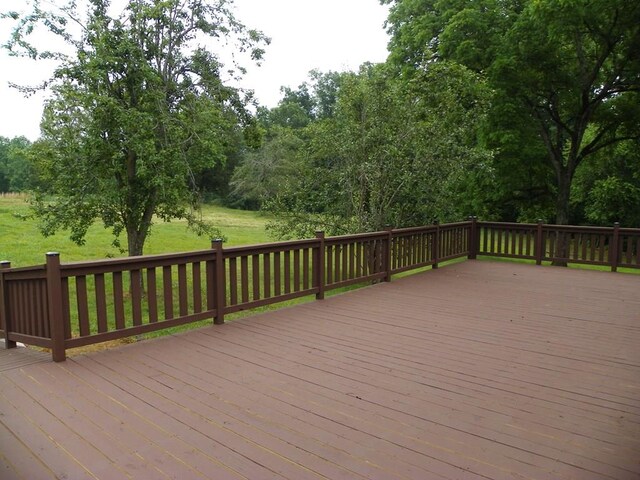 wooden deck with a yard