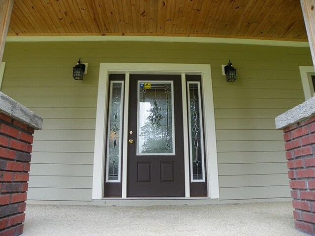 entrance to property with brick siding