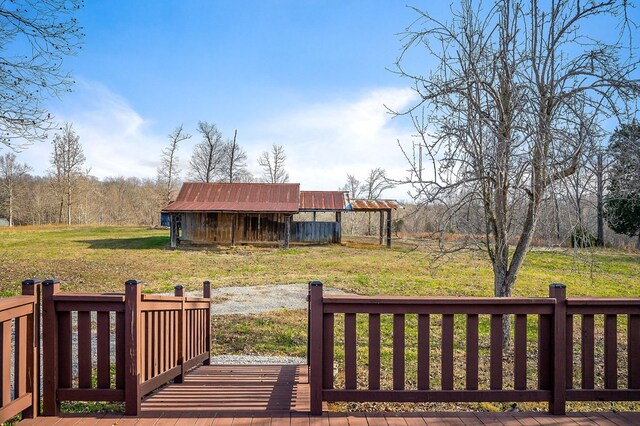 wooden terrace with a yard