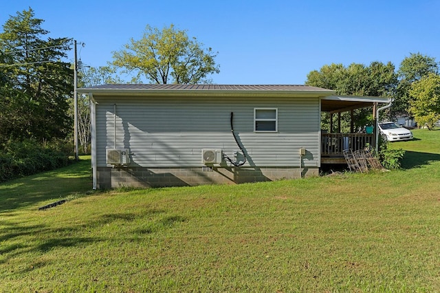 view of property exterior featuring ac unit and a yard