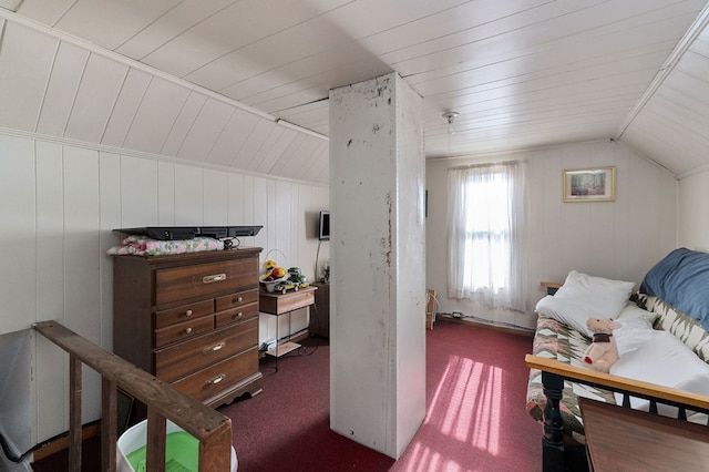 bedroom with vaulted ceiling, dark colored carpet, and wooden ceiling