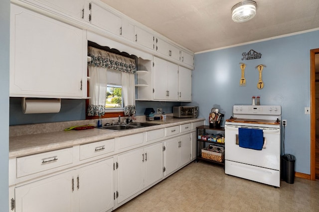 kitchen featuring white cabinetry, light countertops, and electric stove