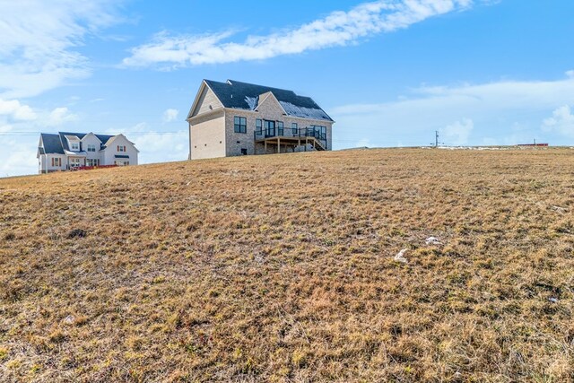 view of yard with a rural view