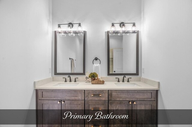 bathroom featuring double vanity and a sink