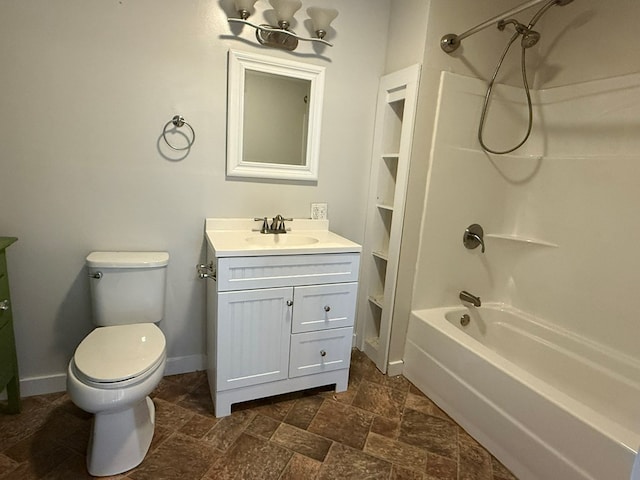 full bath with toilet, vanity, baseboards, tub / shower combination, and stone finish flooring