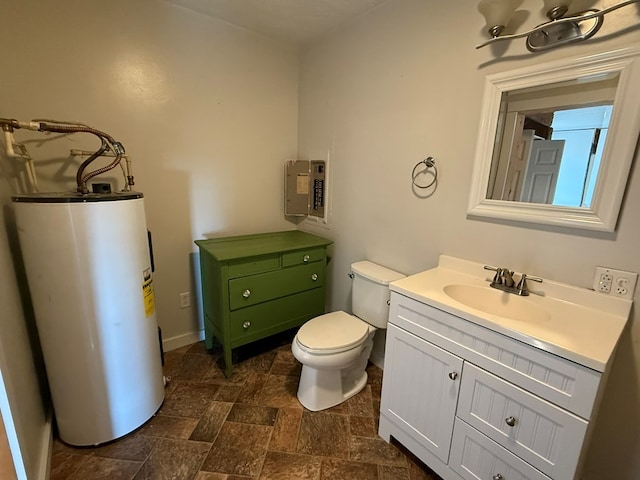 half bath with water heater, toilet, stone finish floor, and vanity