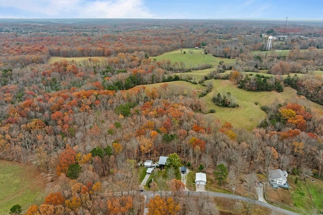 birds eye view of property with a wooded view