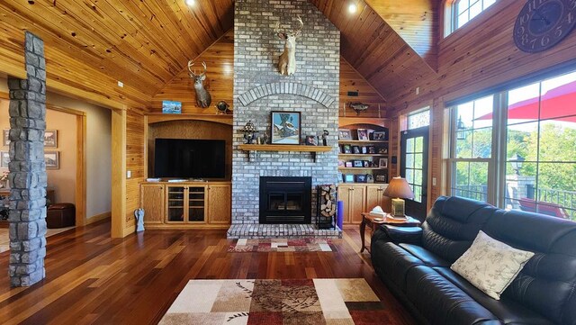 living area featuring dark wood-style floors, wood ceiling, a fireplace, and high vaulted ceiling