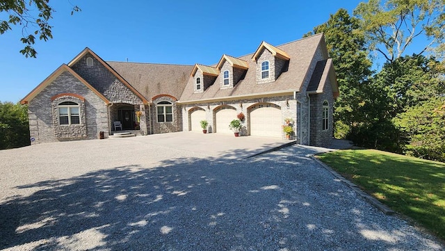 view of front facade with a shingled roof, concrete driveway, an attached garage, a front lawn, and brick siding