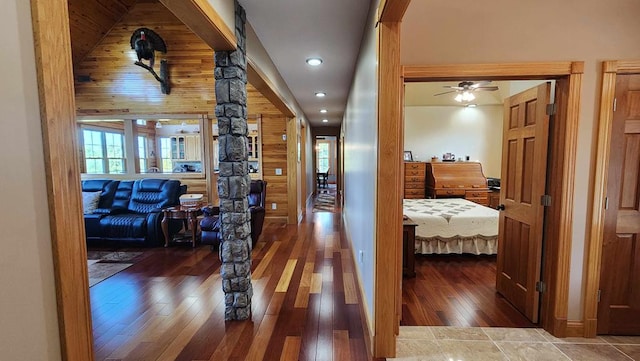 corridor with dark wood-type flooring and recessed lighting