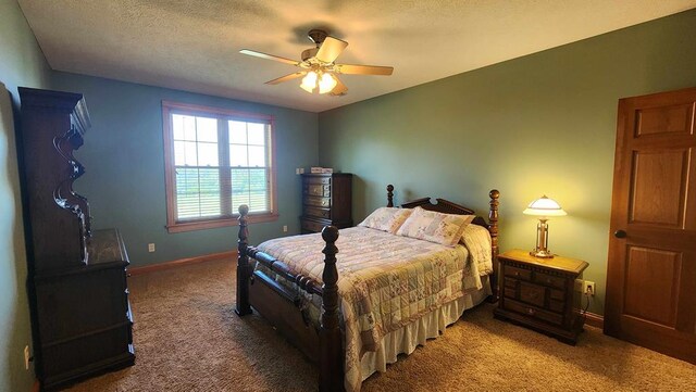 bedroom with dark carpet, a textured ceiling, baseboards, and ceiling fan