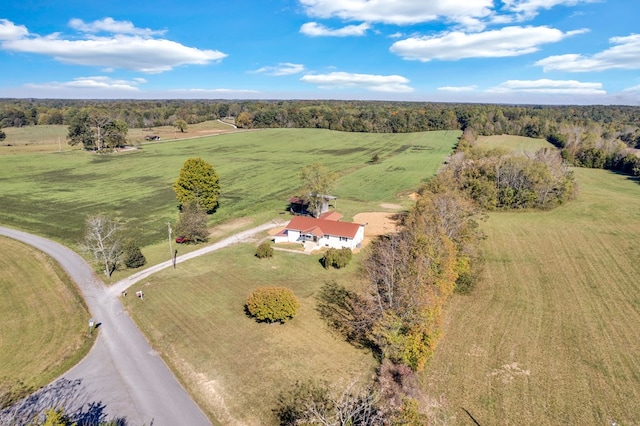 birds eye view of property with a rural view