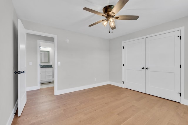 unfurnished bedroom with a ceiling fan, a closet, baseboards, and light wood finished floors