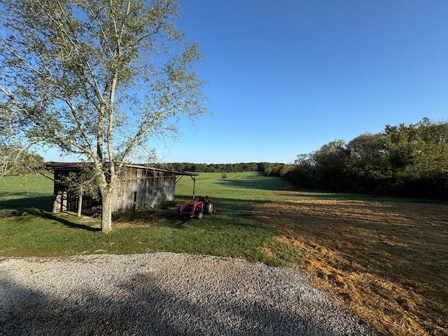 view of yard with an outbuilding and a pole building