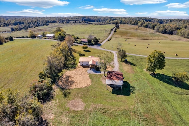 birds eye view of property with a rural view