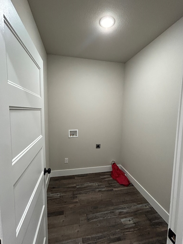 clothes washing area featuring hookup for a washing machine, laundry area, baseboards, dark wood finished floors, and electric dryer hookup