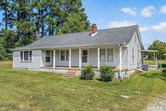 single story home featuring roof with shingles, a porch, a chimney, and a front yard