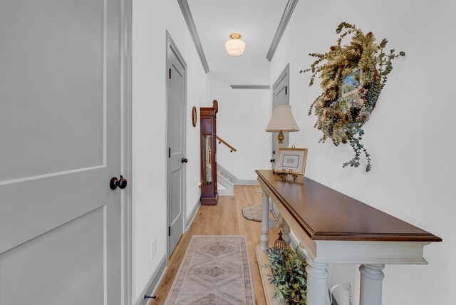 corridor with light wood-style floors