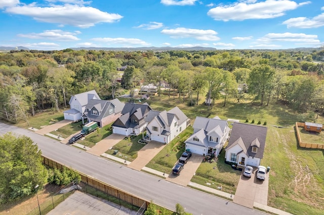 aerial view featuring a residential view and a view of trees