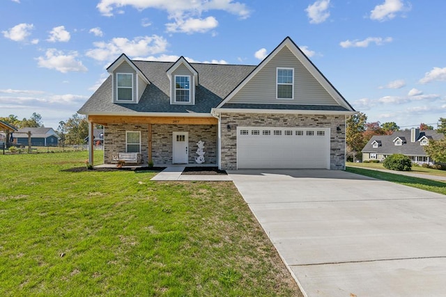 view of front facade with a porch, an attached garage, fence, driveway, and a front lawn