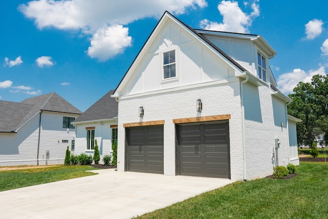 view of property exterior with a yard, brick siding, concrete driveway, and an attached garage