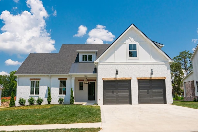 modern farmhouse with a garage, brick siding, driveway, and a front lawn