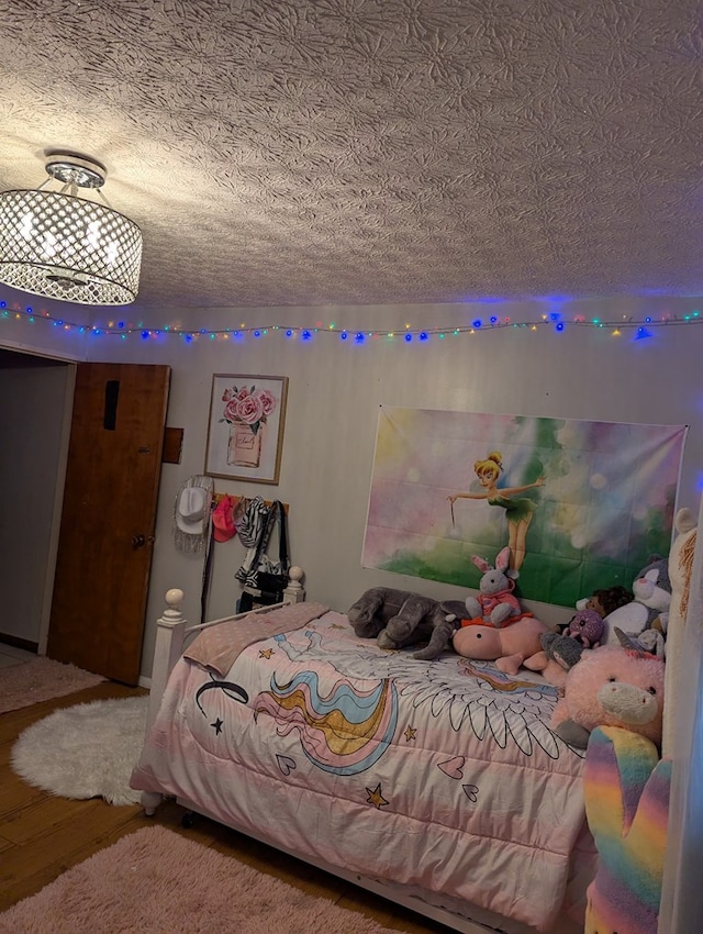 bedroom featuring a textured ceiling