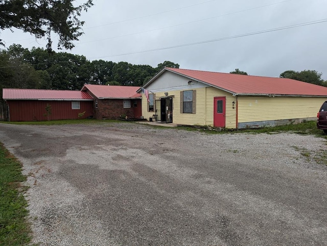 view of front of property featuring metal roof