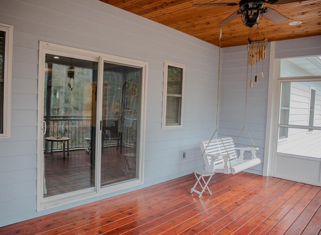 exterior space featuring wood ceiling and ceiling fan